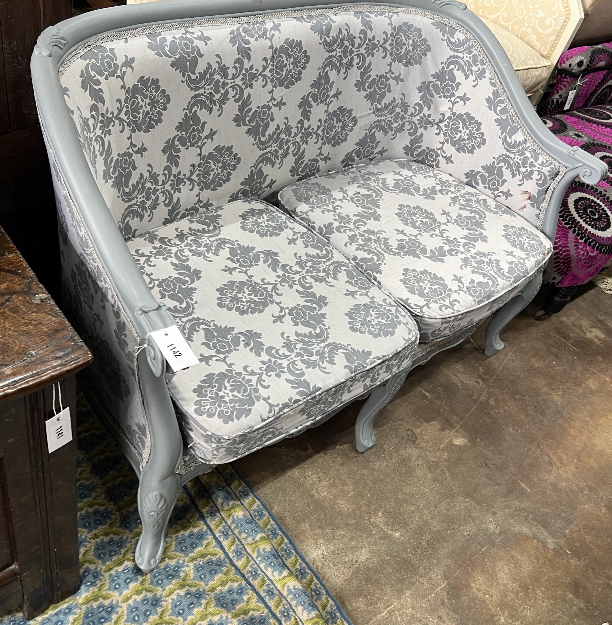 A Louis XVI style upholstered grey painted tub framed two seater settee, length 119cm, depth 60cm, height 82cm